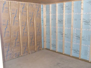 Basement insulation with fiberglass and foam board.
