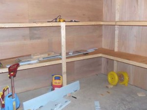 Basement storage room with built-in shelves.